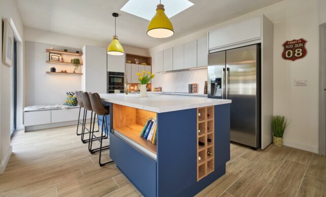 PROJECT SPOTLIGHT | Athgarvan Kitchen

Taking a look back at this stunning Timbercraft Kitchens project — a contemporary handleless design where clean lines, clever detailing and considered use of colour come together beautifully.

Crisp white cabinetry creates a bright, streamlined finish, while the bold blue feature island brings depth and personality to the heart of the room. Oak accents and open shelving introduce warmth and provide the perfect contrast to the contemporary German styling.

The freestanding American-style fridge has been carefully incorporated into the overall design, framed with matching white panels and additional storage above for a seamless, built-in appearance.

One of our favourite features is the bespoke low-level window seating. Designed and installed as an extension of the kitchen furniture, it creates a relaxed spot to sit back and enjoy those picture-window views across the garden. 🌿

Great kitchen design isn’t just about how your kitchen looks — it’s about making every part of the space work beautifully for the way you live.

🏡 Planning a new kitchen?
Visit our showroom and discover what’s possible with Timbercraft Kitchens.

📐 Ready to start your project?
Get in touch with our design team to arrange your kitchen consultation and bring your ideas to life.

👉 Save this post for your kitchen inspiration.
👉 Share it with someone planning their dream kitchen.
👉 Message us today to start designing yours.

#TimbercraftKitchens #GermanKitchens #ContemporaryKitchen #HandlelessKitchen #kitchendesignireland KitchenInspiration BespokeKitchens KitchenIsland BlueKitchen ModernKitchen OpenPlanLiving KitchenSeating InteriorDesign DreamKitchen KitchenRenovation