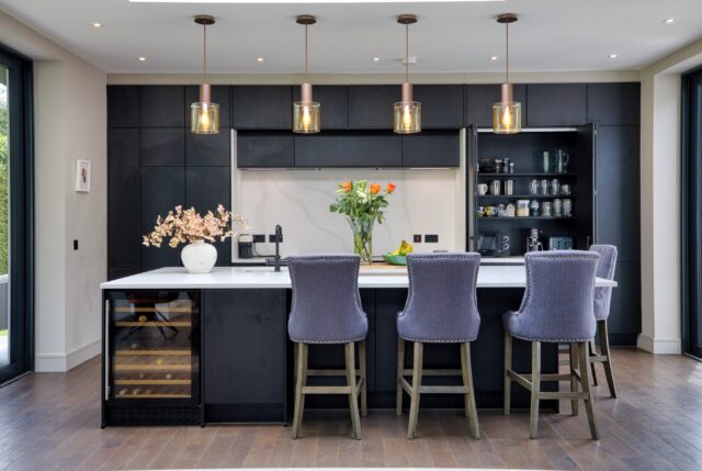 ✨ Designed for the way we live today.

This stunning contemporary kitchen is the perfect example of how thoughtful design can transform everyday living. A rich dark woodgrain finish is beautifully contrasted with crisp white quartz worktops, creating a sophisticated, timeless aesthetic that feels both warm and modern.

At the heart of the space is a generous island featuring an integrated sink, comfortable seating and a feature wine cooler positioned to serve both the kitchen and living area—making it the perfect hub for cooking, entertaining and family life.

Flooded with natural light from the striking roof lantern above and expansive floor-to-ceiling sliding doors opening onto the garden, this open-plan kitchen, dining and living space feels bright, spacious and seamlessly connected to the outdoors.

Modern open-plan living isn’t just about appearance—it’s about creating a home where cooking, dining, relaxing and entertaining all come together effortlessly in one beautifully designed space.

Thinking about your own dream kitchen?

📍Visit our Newbridge or Dún Laoghaire showroom and let our design team help bring your vision to life.

🌐 www.timbercraft.ie

#TimbercraftKitchens #irishkitchensofinsta #ContemporaryKitchen #kitchendesignireland #OpenPlanLiving ModernInteriors KitchenInspiration QuartzWorktops LuxuryKitchen IrishHomes