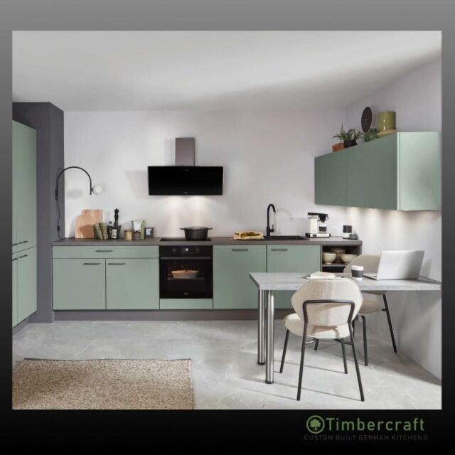 Effortless living, beautifully defined.

Lacquered doors in Premium Honed Olive bring a calm, contemporary tone, complemented by brushed anthracite metal handles on the base and tall units for a refined industrial edge. The handleless wall units keep the look clean and uncluttered, while the Concrete Slate Grey reproduction laminate worktop grounds the space with subtle texture.

A matching table in Stone Grey slate reproduction, finished with sleek stainless steel legs, extends the design seamlessly, creating a space made for both everyday moments and everything in between.

🌱 Let your German dream kitchen come to life with Timbercraft custom-built German designs!

💡 Ready to elevate your space? Visit us at timbercraft.ie.

#germankitchen #modernkitchen #homedesign #kitchendesign #bespokekitchen