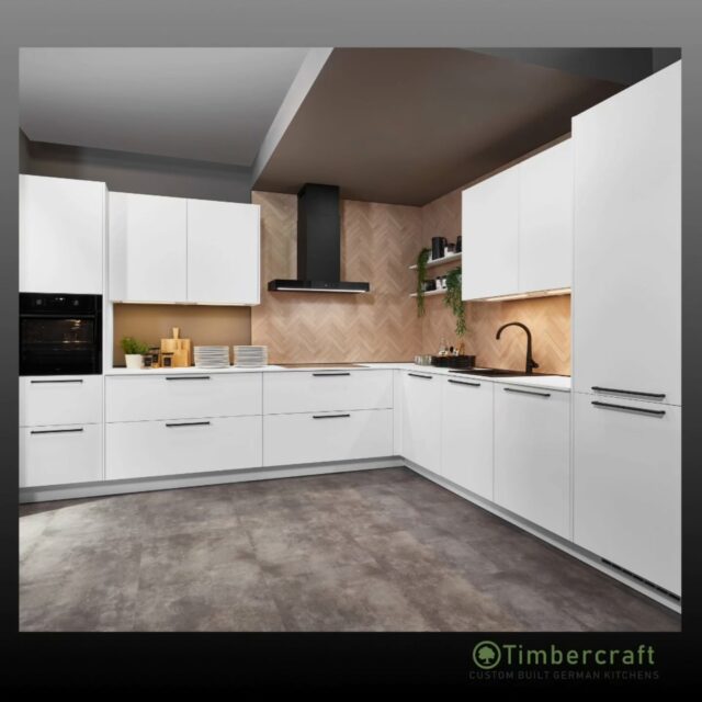 Clean, modern and effortlessly stylish 🤍

This kitchen features Alpine white ultra matt lacquered doors, paired with black bar handles for a sharp, contemporary contrast. A 20mm white ceramic worktop keeps the look crisp and durable, while the Como oak herringbone niche cladding adds warmth and texture.

Minimalist design, elevated with natural detail.

🌱 Let your German dream kitchen come to life with Timbercraft custom-built German designs!

💡 Ready to elevate your space? Visit us at timbercraft.ie.

#germankitchen #modernkitchen #homedesign #kitchendesign #bespokekitchen
