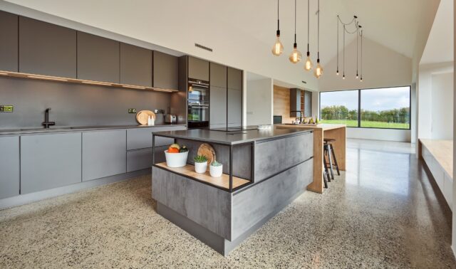 Industrial character. Contemporary German precision 🇩🇪 

This stunning @timbercraftireland project perfectly balances bold industrial styling with the warmth of natural materials.

The concrete-effect cabinetry creates a striking architectural look, while the raised natural wood breakfast bar softens the space, adding texture, warmth and an inviting place to gather. Paired with clean handleless lines, integrated appliances and dramatic lighting, the result is a kitchen that’s as practical as it is visually impressive.

Designed for modern living, this space proves that contemporary German kitchens can be both minimalist and welcoming.

Thinking about your own kitchen transformation?

Visit our Newbridge or Dún Laoghaire showroom and let our expert designers help bring your vision to life. Book your design appointment today and discover what’s possible with Timbercraft Kitchens. 📲📧☎️

#TimbercraftKitchens #GermanKitchens #ContemporaryKitchen #KitchenDesign #irishkitchensofinsta IndustrialKitchen HandlelessKitchen KitchenInspiration IrishHomes LuxuryInteriors
